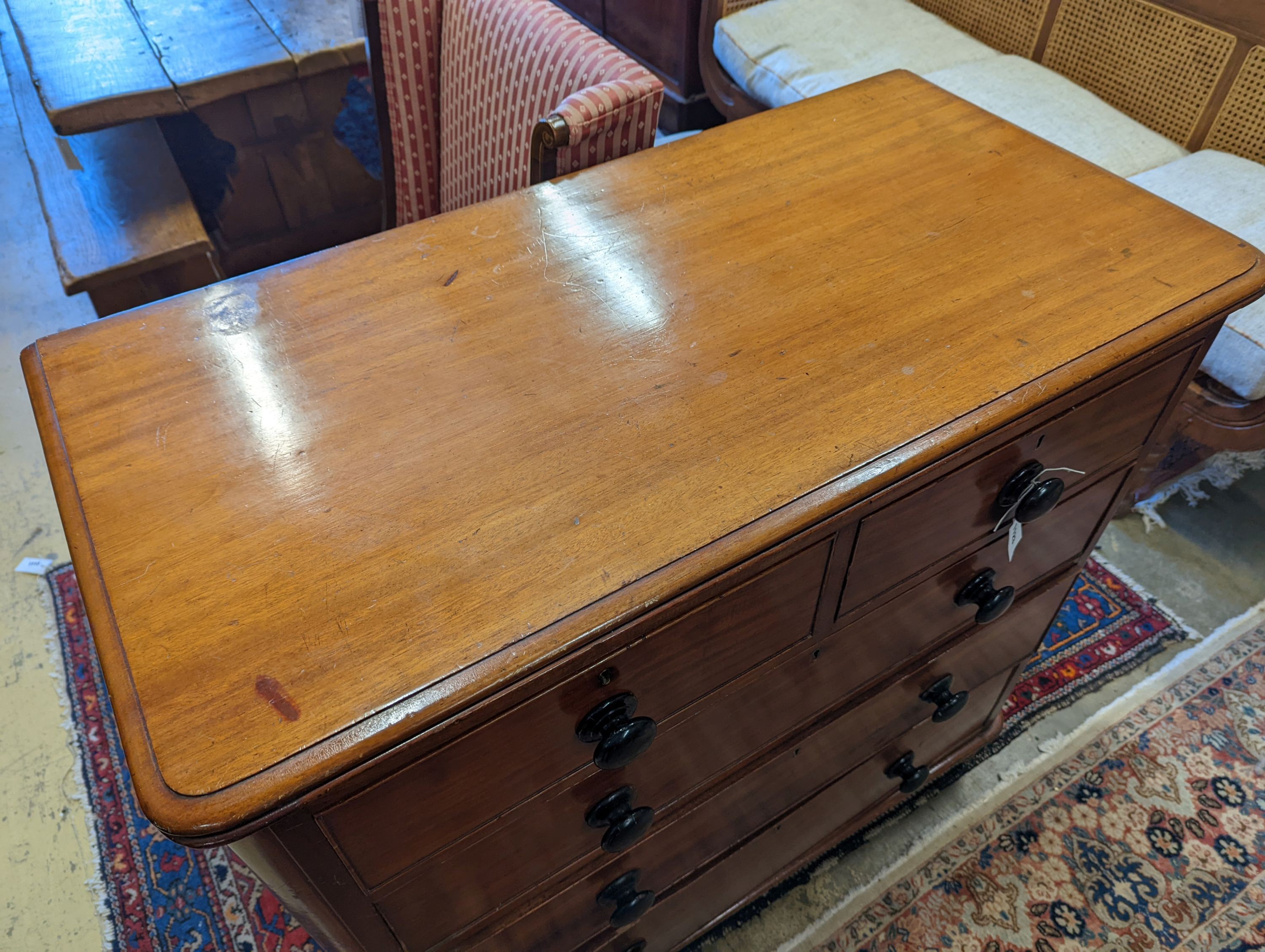 A mahogany chest of two short and three long drawers with turned handles, width 105cm, depth 53cm, height 106cm